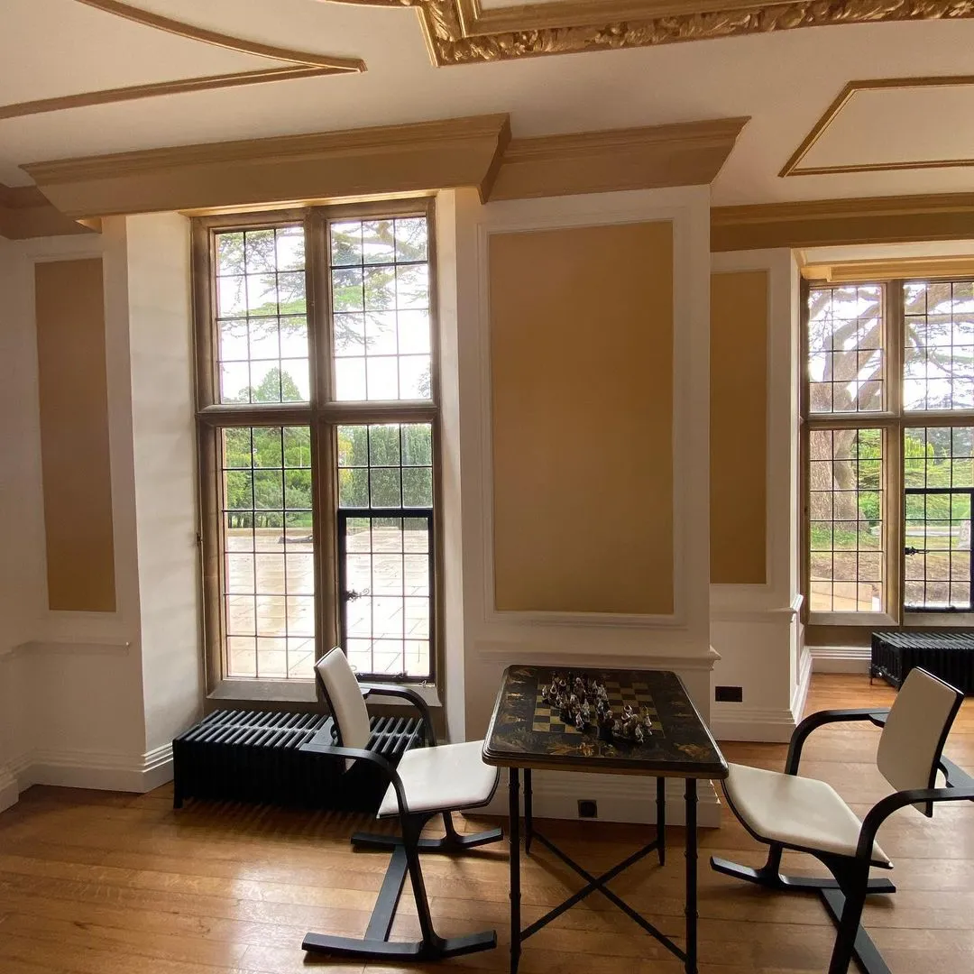 Panelled drawing room with gold panels